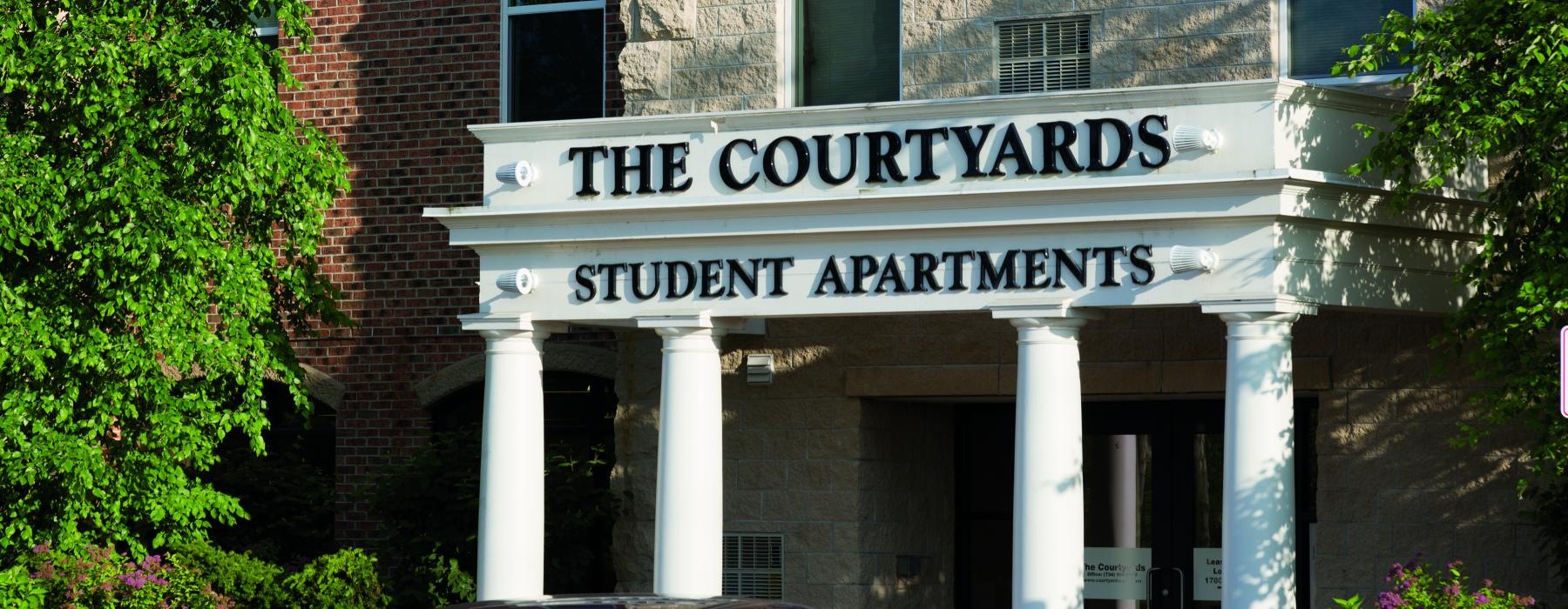 a building with columns and a sign